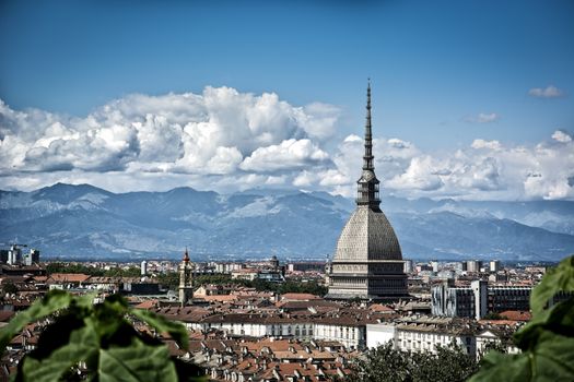 Panoramic view of Turin city center, in Italy, in a sunny day, with Mole Antonelliana and Alps in the background