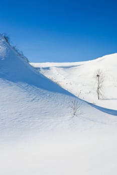Beautiful winter landscape with snow-covered hills
