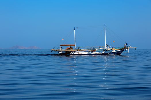 Boat driving on the water in Komodo national park