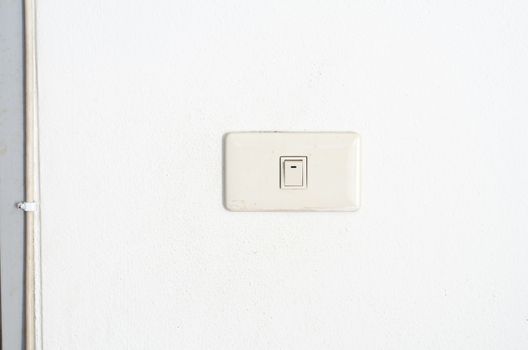 electric white switch on wall