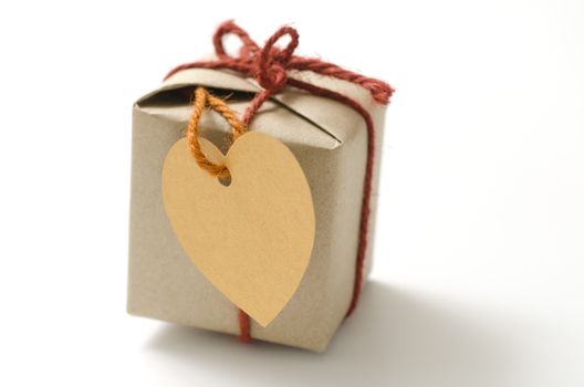 heart tag with single craft cardboard gift box on a white background