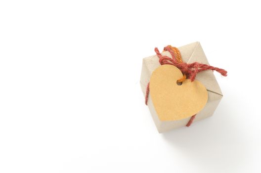 heart tag with single craft cardboard gift box on a white background