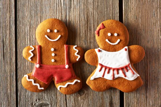 Christmas homemade gingerbread couple cookies on wooden table