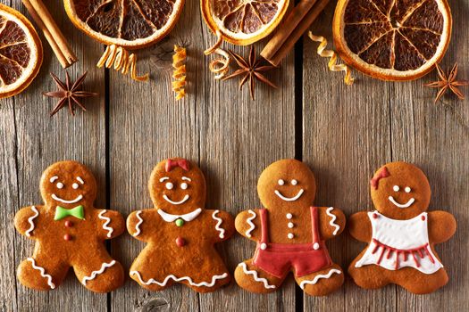 Christmas homemade gingerbread couple cookies on wooden table