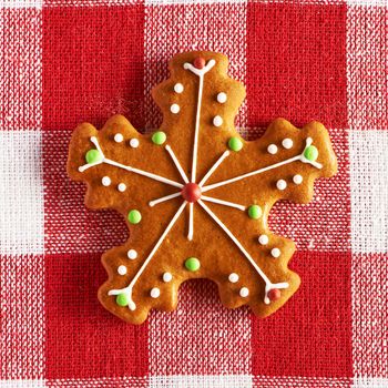 Christmas homemade gingerbread cookie on tablecloth