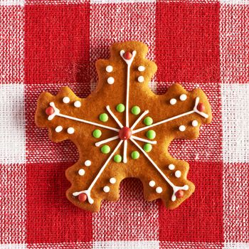 Christmas homemade gingerbread cookie on tablecloth