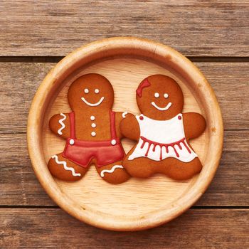 Christmas homemade gingerbread couple on table