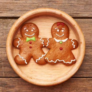 Christmas homemade gingerbread couple on table