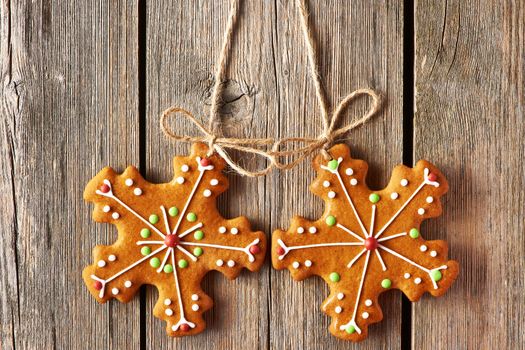 Christmas homemade gingerbread cookies over wooden background