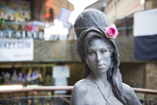 LONDON, UK - SEPTEMBER 17: Bronze statue of late singer Amy Winehouse in Camden Town. It was unveiled on what would have been her 31st birthday, 3 years after her death. September 17, 2014 in London.