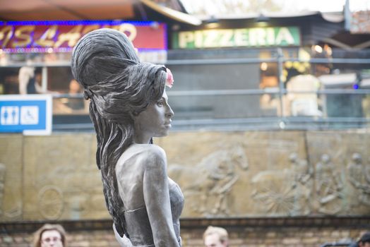 LONDON, UK - SEPTEMBER 17: Bronze statue of late singer Amy Winehouse in Camden Town. It was unveiled on what would have been her 31st birthday, 3 years after her death. September 17, 2014 in London.