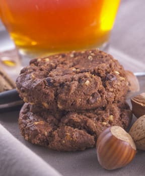 Biscuits in between tea, almond and nuts