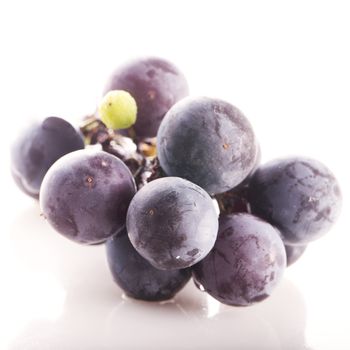 Black grape isolated over a white background