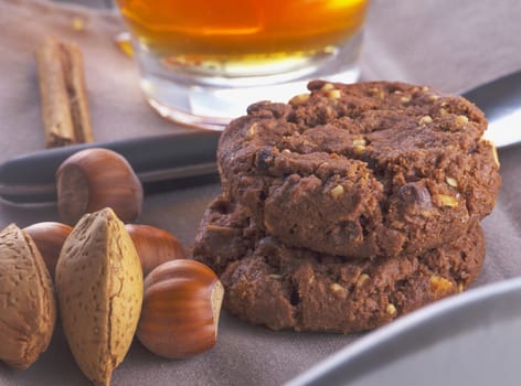 Biscuits in between tea, almond and nuts