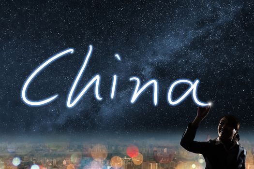 Concept of China, silhouette asian business woman light drawing.