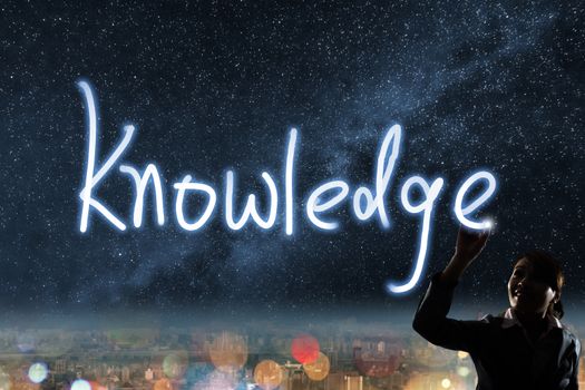 Concept of knowledge, silhouette asian business woman light drawing.