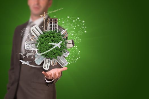 Businessman holding earth with buildings. Business concept