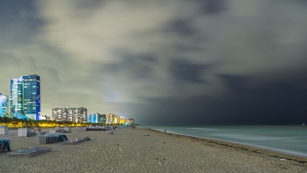 Miami beach unusually empty and quite, and only accompanied by the multi-story buildings in the background