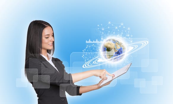 Beautiful businesswomen in suit using digital tablet. Earth with graphs, network and rectangles. Element of this image furnished by NASA