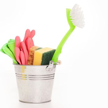 Cleaning sponges in a silver pail isolated on a white background