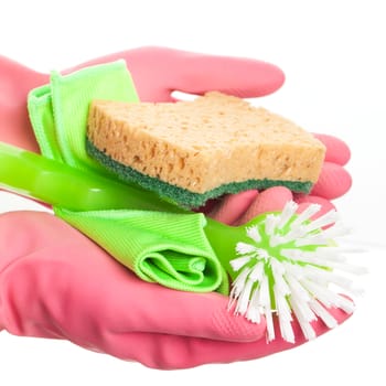 Hand in a pink glove holding domestic sponge