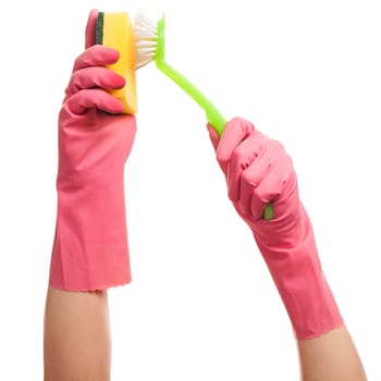 Hands in a pink gloves holding sponge and brush isolated over white background