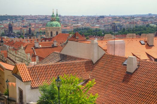 Photo shows details Prague red roofs.