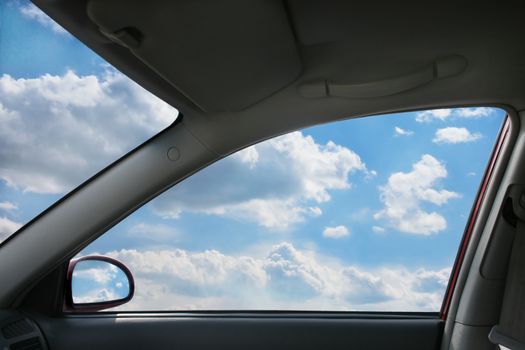Heavenly landscape behind  car window