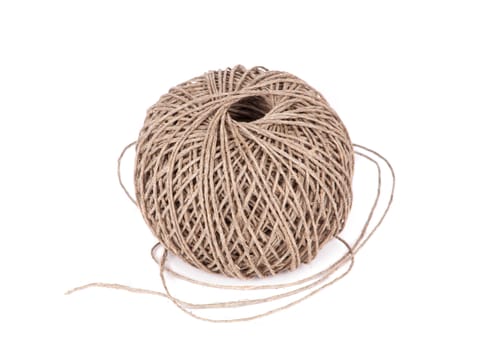 Ball of brown cotton cord on white background