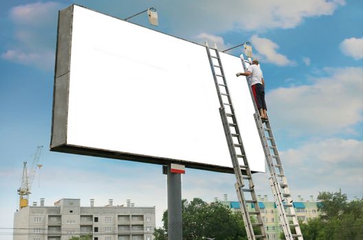 Rectangular white billboard and the worker changing the information