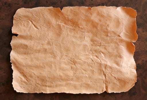 Old crushed paper on brown background