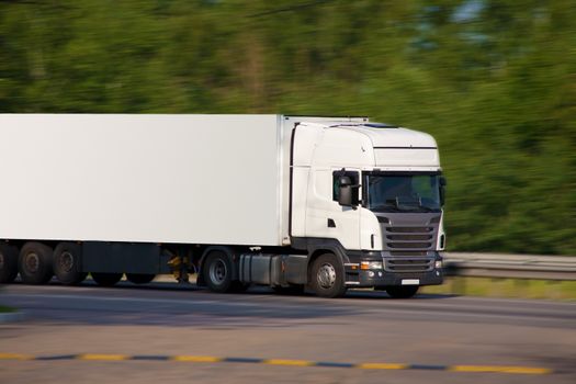 big white trailer transporting cargo 