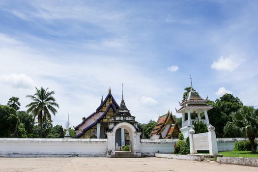 Thai uniting temple named Wat Prathat-Tung-Yung against blue sky in Uttaradit, Thailand