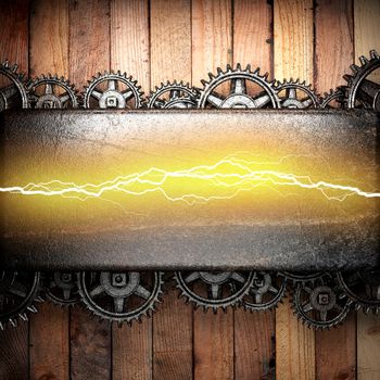 wooden background with cogwheel gears and electric lightning