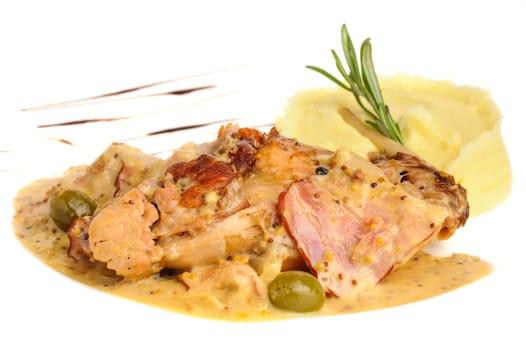 Stewed rabbit legs with potato puree and rosemary