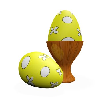 Two yellow painted Easter eggs with floral design, one placed in a wooden egg cup and the other lying outside. 
