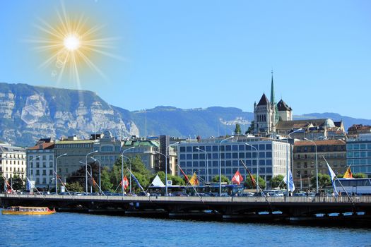 Mont-Blanc bridge and Saint-Pierre cathedral tower by beautiful day, Geneva, Switzerland