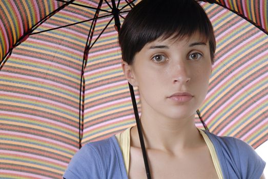 young brunette girl with umbrella, studio picture