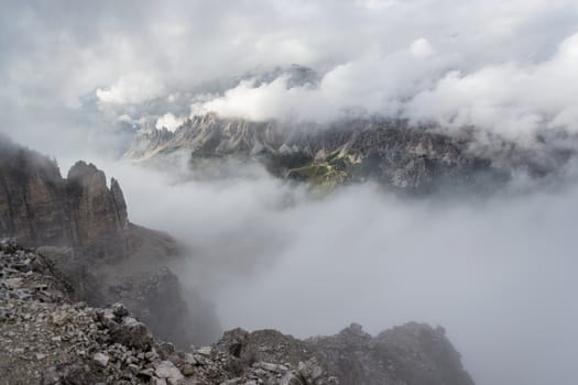 Italian Alps, View of Val Gardena from the top of the mountain between the clouds