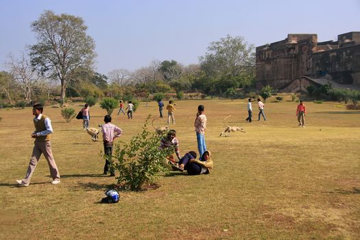 Local teenagers playing in a field at Ranthambore Fort, Rajasthan, India