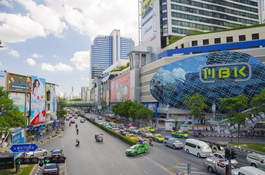 traffic in front of mahboonkrong shopping center on 3 July 2014 BANGKOK THAILAND. Mahboonkrong or MBK shopping center is a large shopping mall in Bangkok. july 3, 2014 in Bangkok, Thailand