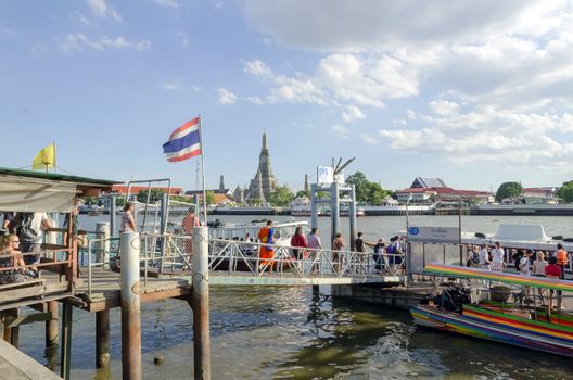 BANGKOK - JULY 3: Group of people aboarding to chao phraya ferry boat, Chao Phraya is a major river in Thailand, low alluvial plain forming the centre of the country. July 3, 2014 in Bangkok,Thailand