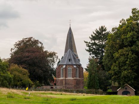 Church behind a green on a golf course