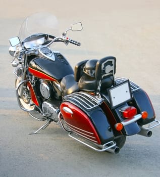 big beautiful red motorcycle on asphalt