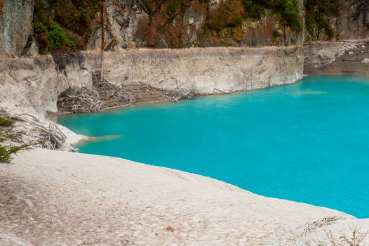 Incredibly blue and highly acidic Inferno Crater Lake at Waimangu geothermal area, New Zealand