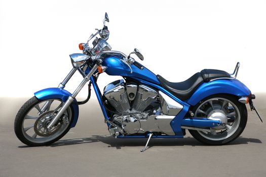 blue beautiful powerful motorcycle on asphalt