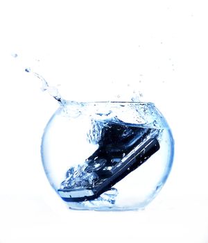 Black mobile phone thrown in aquarium.