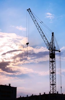 building crane against the evening sky