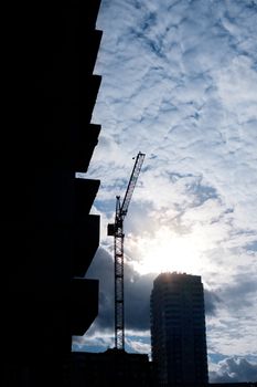 Building site and cranes on sunset