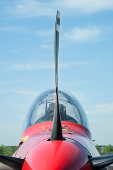 closeup of a light aircraft propeller blade and canopy